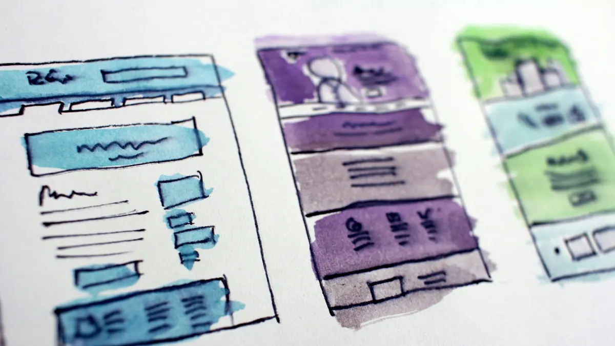 Watercolour wireframe sketches of website page layouts